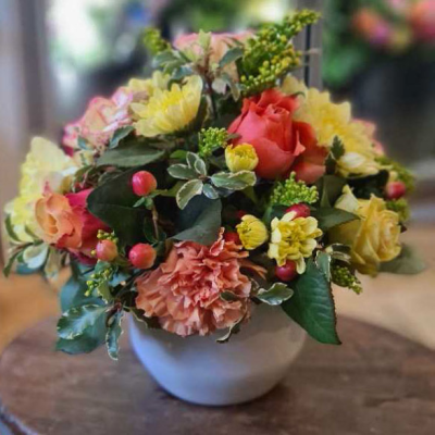 A New Day - An elegant pot arrangement with cream and white flowers, perfect for adding a touch of charm to any home or event.