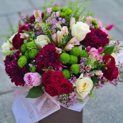 Romantic Red and Green Bouquet - A vibrant and romantic bouquet with a mix of red, green, and white flowers, ideal for celebrating love and special moments.