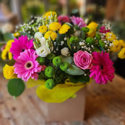 Bright and Bold - A lively and colourful box arrangement with a mix of bright flowers, designed to bring joy and energy to any occasion.